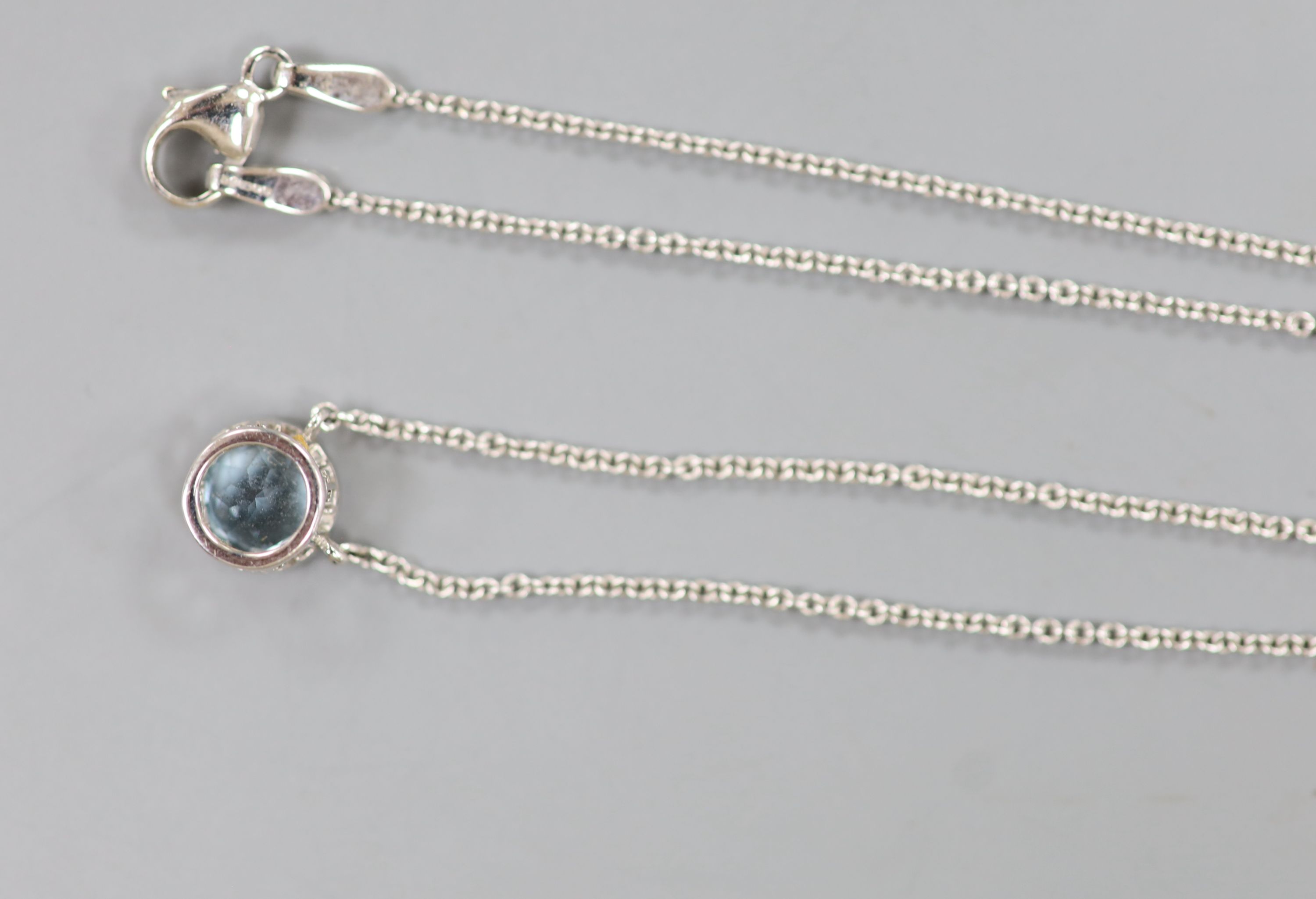 A modern Theo Fennell 18ct white gold and solitaire blue topaz set pendant necklace